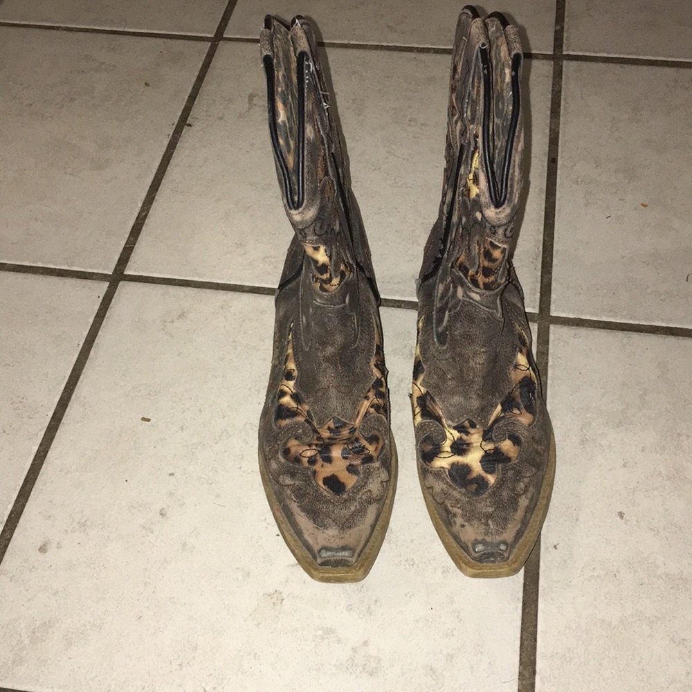 Brown Leopard print pointed toe boots.